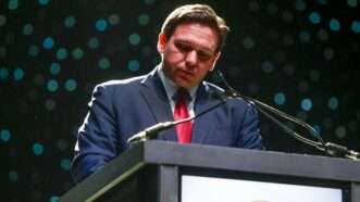 Florida Gov. Ron DeSantis looks down during a speech | Ivy Ceballo/ZUMA Press/Newscom