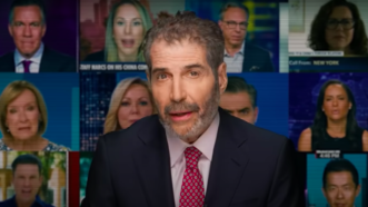 John Stossel is seen in front of television screens with multiple journalists | Stossel TV
